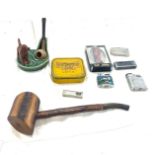 Tray of collectable pieces to include lighters, wade pipe stand, large pipe