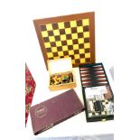 Selection of games includes chess board and pieces, scrabble and a traveling game set