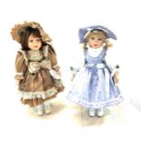 2 Vintage dolls on stands