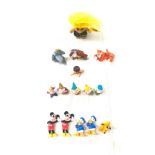 Selection of Disney collector figures includes snow white figures, mickey mouse and friends,