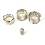 3 Silver napkin rings, silver thimble