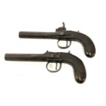 A pair of antique percussion pistols by Baker London, with belt hooks, approximate length 19cm,