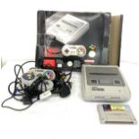 Boxed Super Nintendo console, 2 control pads, charger, leads and game, untested