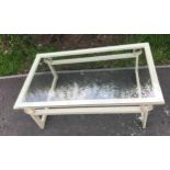 Metal and glass coffee table measures approx 16 inches tall 49 inches wide 29.5 inches depth