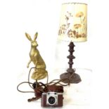 Assortment of items to include wooden table lamp, hare ornament, vintage camera Paxette, untested