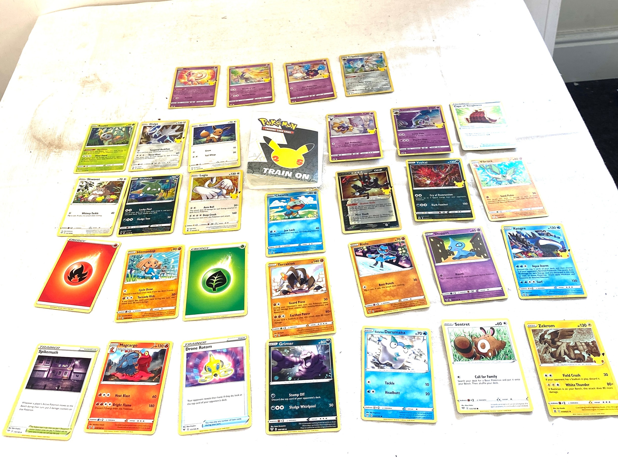 Selection of Pokemon 25th Anniversary collectors cards