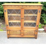 Old charm 4 door glazed bookcase, approximate measurements: Height 45 inches, Width 42 inches, Depth