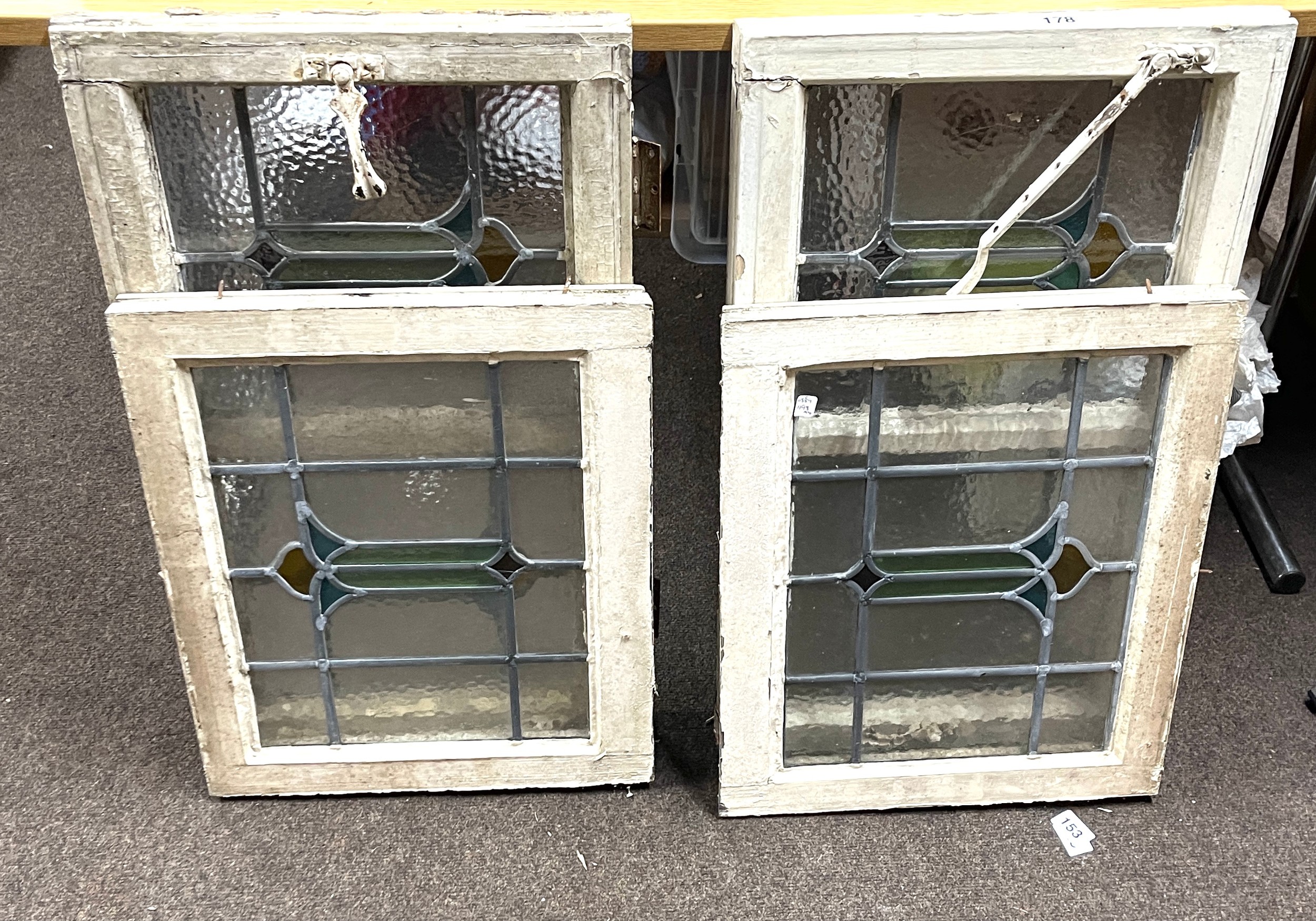 4 Pieces of leaded glass window, largest measures 28 inches by 17 inches