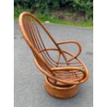 Cane swival lounge chair, no cushions, approximate measurements: Height: 40 inches