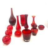 Selection of ruby coloured glassware, includes vases, tea light holders etc