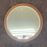 Vintage teak framed beveled edge mirror measures approx 23 inches diameter