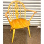 Mid century Ercol carver chair measures 32 inches tall