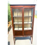 Two door glazed display case measures approx height 68 inches by 34inches width and 12 inches depth