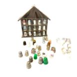 Selection of thimbles and display case