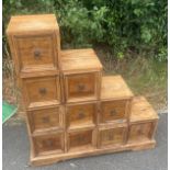 Ten drawer pine staircase storage unit measures approx 33 inches tall by 32inches width and 9 inches