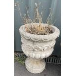 Concrete garden planter measures approx 18 inches tall