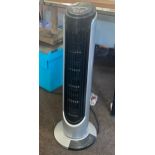 Upright rotating tower fan