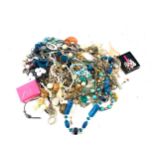 Large selection of assorted costume jewellery includes necklaces, earrings etc