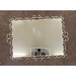 Vintage wrought iron framed mirror measures approx 35.5 inches wide, 26.5 inches tall