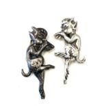 Sterling silver pixie brooch, one white metal pixie brooch