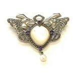 Large impressive silver brooch set with marcasite and amethyst mother of pearl centre flanked by