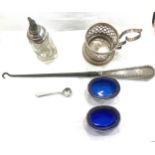 Selection of silver items includes 2 silver lined salts, silver handled button hook, silver rimmed