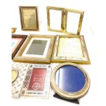 Selection of assorted picture frames largest measures 8.5 inches tall 6.5inches wide