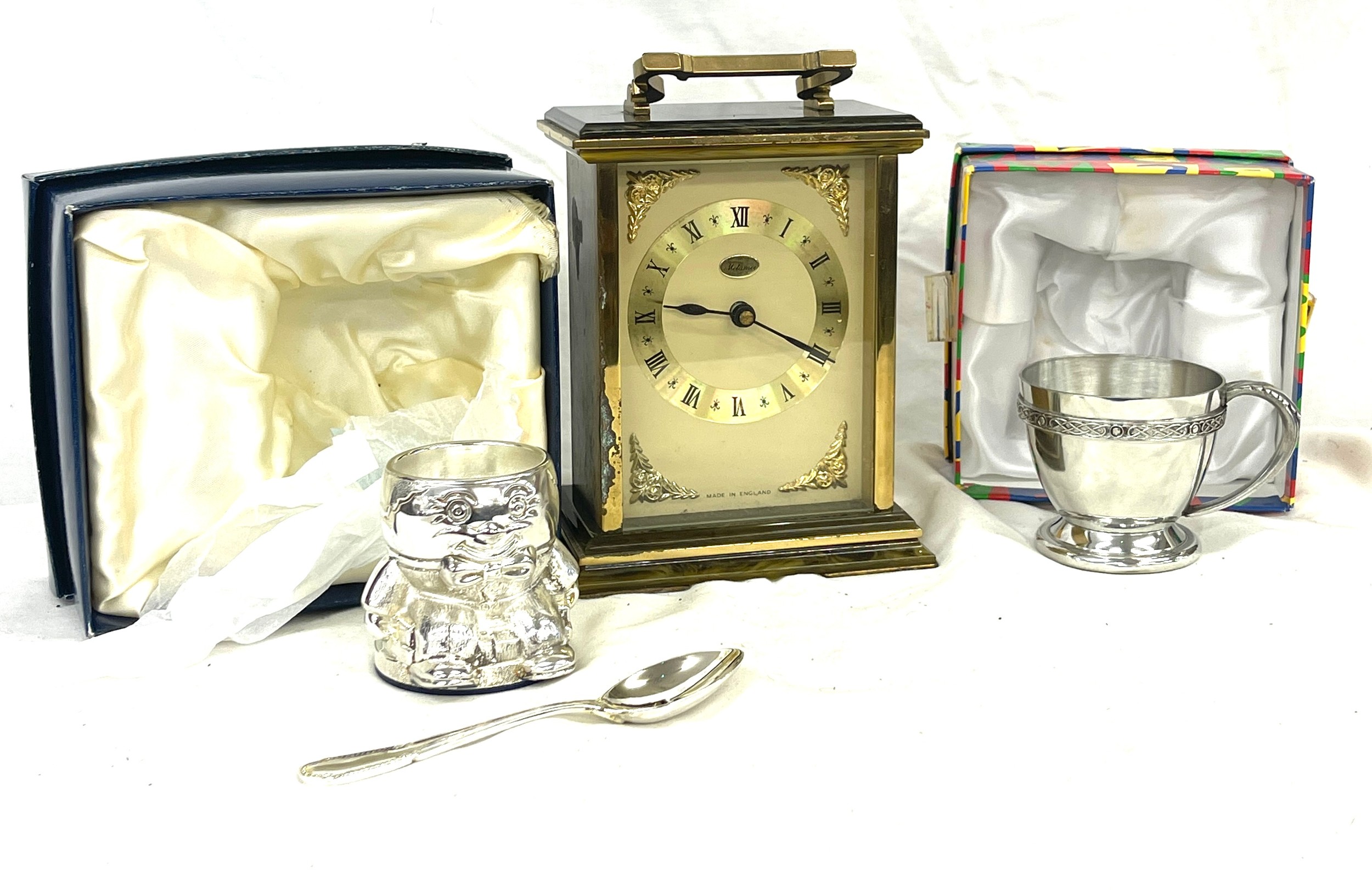 Metamec carriage clock, cased egg and spoon set and a cased christening mug