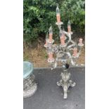 Silver coloured tall candelabra and glass topped side table, untested, approximate height of