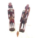 Selection of carved wooden african items includes mask etc , largest measures 65 cm tall