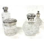 Two silver topped cut glass perfume bottles, silver topped jar and silver topped perfume dispenser