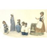 Selection of 5 Nao figures to include girl with dog, girl with teddy, girl praying, boys choir