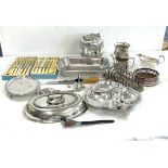 Large selection of silver plated items to include cutlery, toast rack, biscuit barrel, condiments,