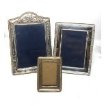 3 silver picture frames largest measures approx 24cm by 16.5cm