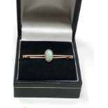 Antique 15ct gold opal brooch set with central opal that measures approx 13mm by 5.5mm frame xrt