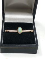 Antique 15ct gold opal brooch set with central opal that measures approx 13mm by 5.5mm frame xrt