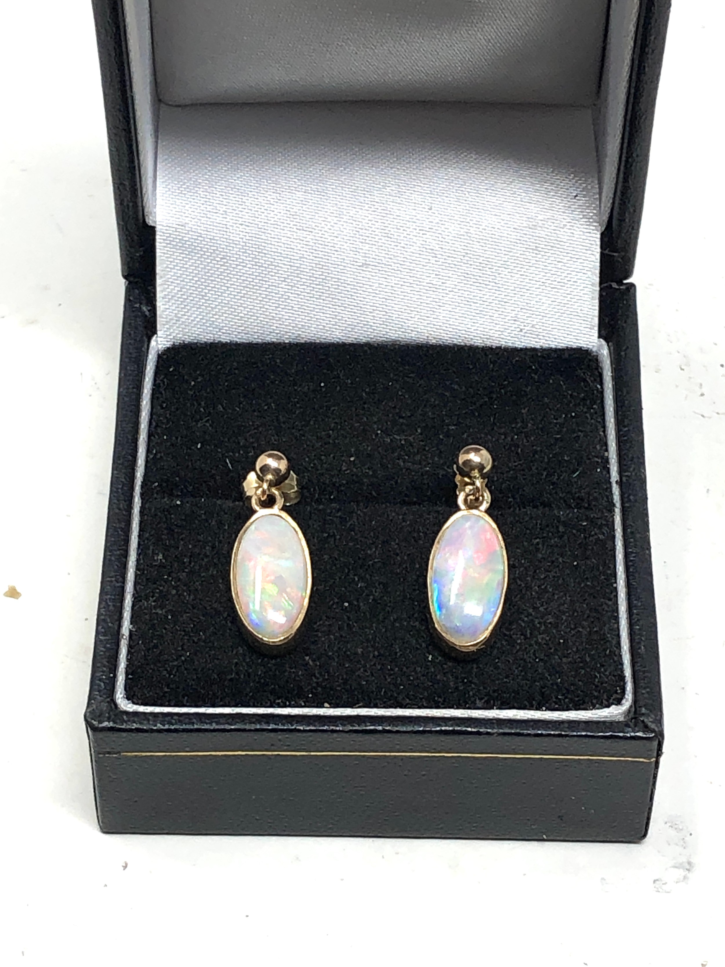 Fine 9ct gold opal earrings measure approx 1.9cm drop by 6.5cm wide opals measure approx 12mm by 6mm