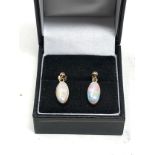 Fine 9ct gold opal earrings measure approx 1.9cm drop by 6.5cm wide opals measure approx 12mm by 6mm