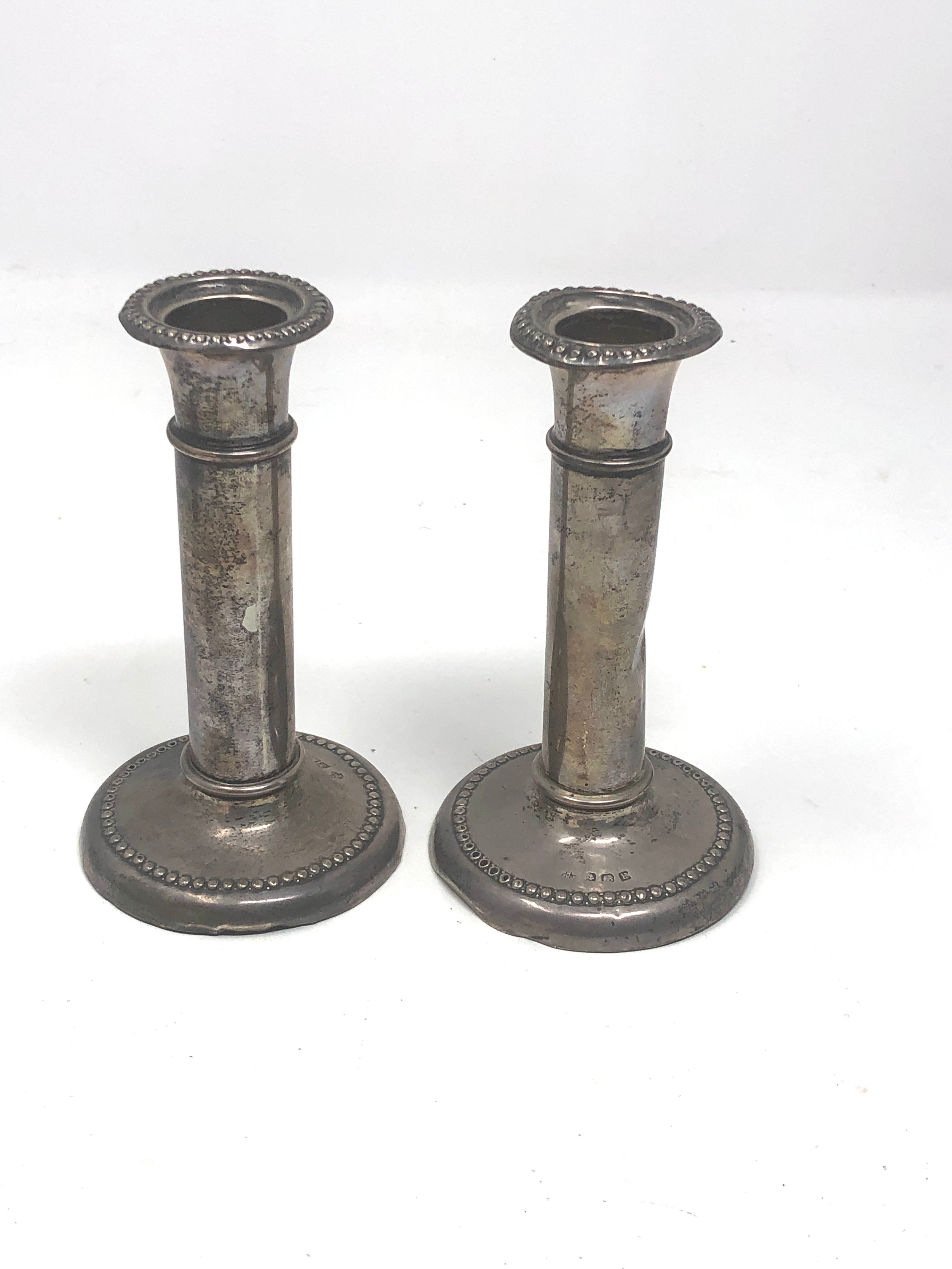 Pair of antique silver candlesticks birmingham silver hallmarks height approx 13cm