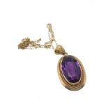 14ct gold synthethic colour change sapphire pendant on 9ct gold chain (6.9g)