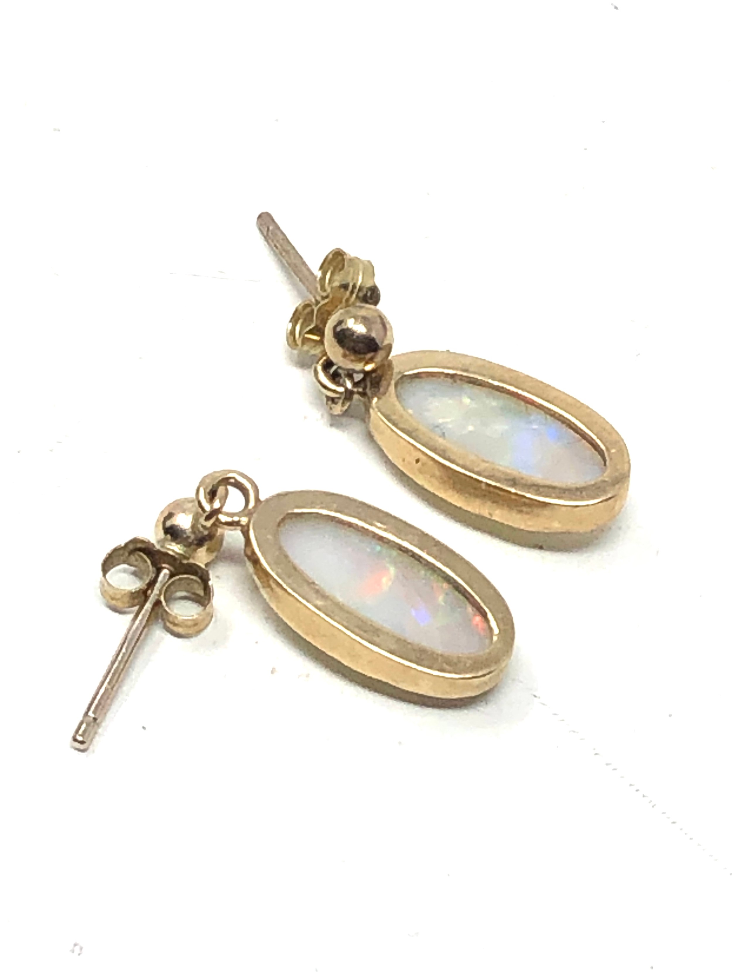 Fine 9ct gold opal earrings measure approx 1.9cm drop by 6.5cm wide opals measure approx 12mm by 6mm - Image 5 of 5
