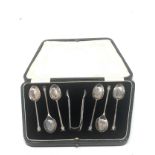 Boxed set of silver tea spoons & sugar tongs