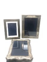 3 silver picture frames largest measures approx 18cm by 14cm