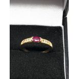 Fine 18ct gold ruby & diamond ring centaralruby measures approx 4mm by 3mm with diamond shoulders