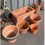 Selection of terracotta garden planters to include chinmey pots etc