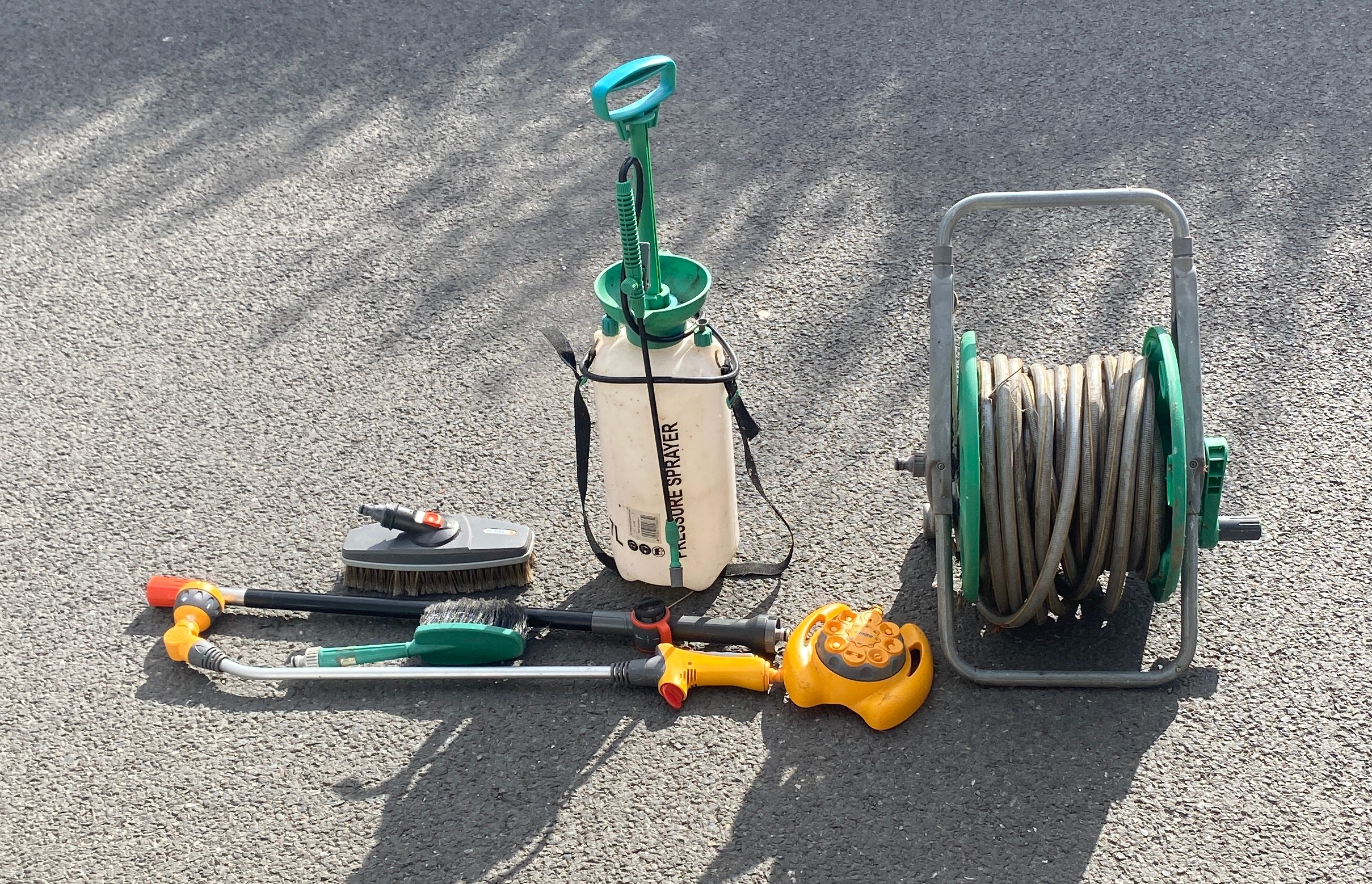 Selection of garden tools to include hose pipe on reel, sprayers etc