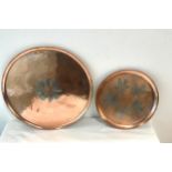 2 Copper trays, one signed, diameter of largest 14.5 inches