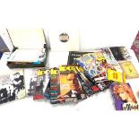 Large selection of miscellaneous includes novelty lighters, assorted novelty key rings, books and