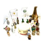 Wade bells Whiskey ashtray, 2 advertising jugs and a selection of Alcohol miniatures