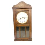 Edwardian two key hole oak wall clock with key and pendalum, untested